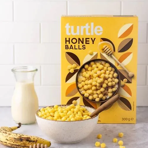 turtle Cerealien Bio Honey Balls 300 g - Produkttyp: Getreide - Nährwertangabe pro: 100 g - Energiegehalt (in kj): 1534 KJ - Energiegehalt (in kcal): 361 Kcal - Fett: 0.6 g - Gesättigte Fettsäuren: 0.1 g